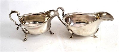 Lot 93 - Two similar silver sauce boats, Sheffield 1934 and Birmingham 1928