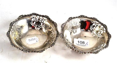 Lot 108 - A pair of silver dishes, London 1937 with pierced sides and cast rim (2)