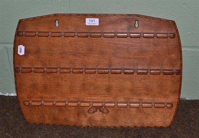 Lot 141 - A Yorkshire School oak spoon rack, with three rails, carved acorns, monogrammed JDC and dated 1980