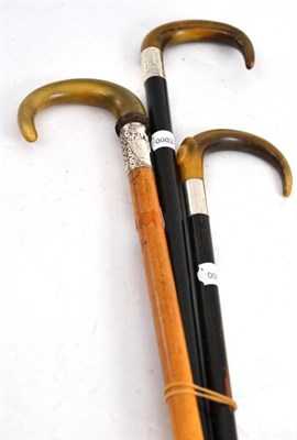 Lot 144 - Three horn handled walking sticks