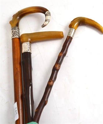 Lot 145 - Three horn handled walking sticks