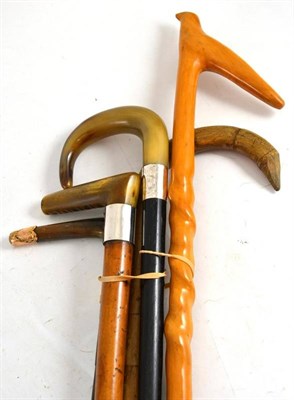 Lot 147 - Five horn and wood walking sticks