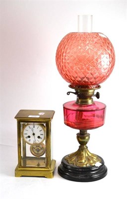 Lot 204 - Brass mantel clock and oil lamp