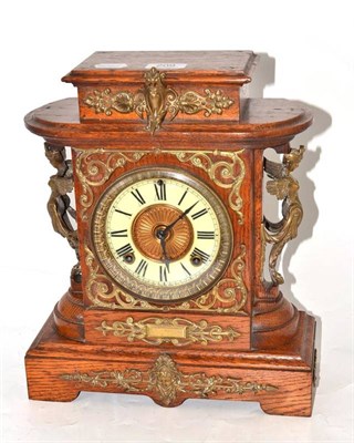 Lot 209 - Oak mantel clock with brass figural mounts stamped 'The Ansonia Clock Company'