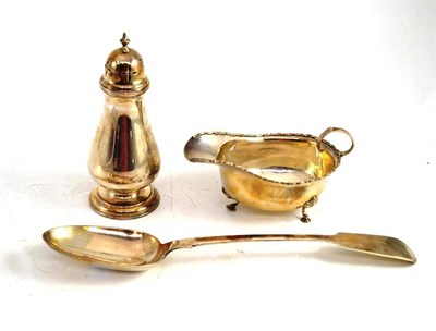 Lot 218 - A Victorian silver basting spoon, London 1867, a silver sauce boat and a sugar caster