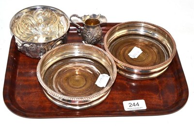 Lot 244 - A small silver bowl, cream jug and pair of plate coasters