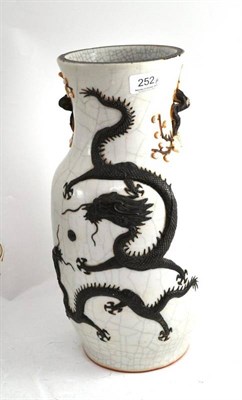 Lot 252 - A Chinese crackle glaze vase decorated with two duelling dragons, signed