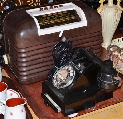 Lot 265 - A Bush Bakelite radio and a black Bakelite telephone