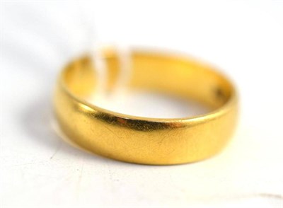 Lot 286 - An 18ct gold band ring