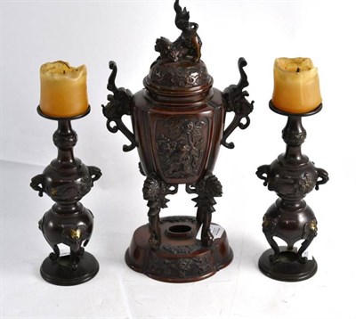 Lot 303 - A Japanese bronze censer and cover and a pair of similar candlesticks