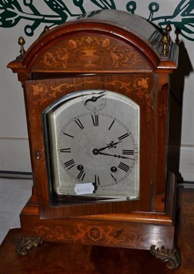 Lot 313 - A LenzKirch rosewood marquetry striking mantel clock