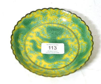 Lot 113 - A Chinese Porcelain Saucer, painted in green with dragons chasing the flaming pearl on a yellow...