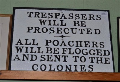 Lot 377 - A reproduction cast iron sign ";Trespassers with be prosecuted - all poachers will be flogged...