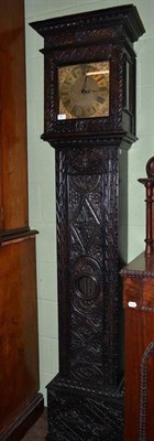 Lot 401 - A thirty hour longcase clock with carved oak case