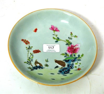 Lot 117 - A Chinese Famille Rose Saucer Dish, decorated with quail, rockwork and flowering peony, on a...
