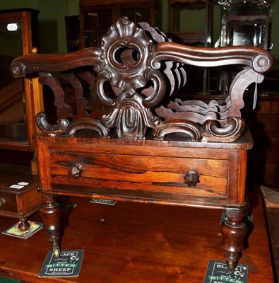 Lot 433 - An early Victorian rosewood four division Canterbury on brass castors