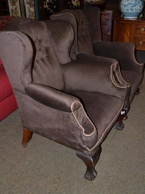 Lot 456 - Two 19th century wing back chairs, one on carved claw and ball feet