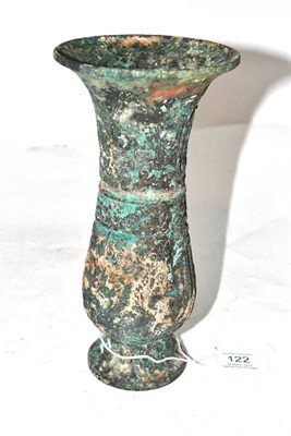 Lot 122 - A Chinese Bronze Baluster Vase, of archaic form with flared rim and circular foot, cast with formal