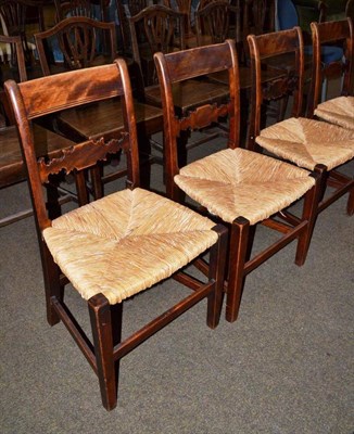 Lot 470 - Six rush seated mahogany country chairs