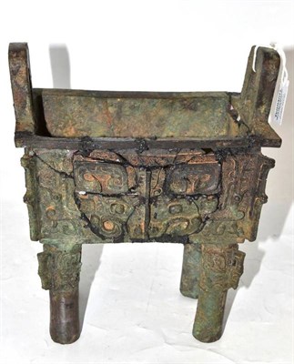 Lot 123 - A Chinese Bronze Ritual Food Vessel, in archaic style, of rectangular form with loop handles...
