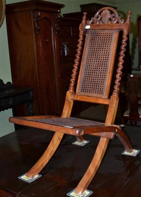 Lot 478 - A Victorian walnut framed folding side chair with cane back and seat