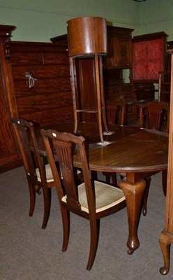 Lot 488 - A mahogany jardiniere stand, a dining table with two leaves and four inlaid mahogany chairs