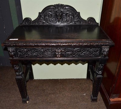 Lot 509 - Carved oak Victorian side table