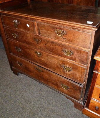 Lot 512 - A George III oak four height chest of drawers