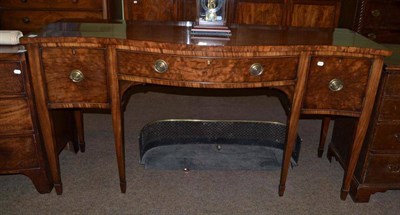 Lot 513 - An early 19th century serpentine fronted mahogany sideboard