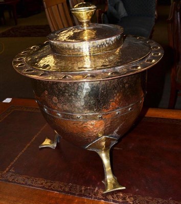 Lot 523 - An Arts & Crafts brass coal scuttle