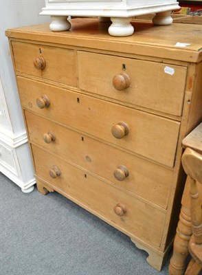 Lot 559 - Pine chest and a pine mirror