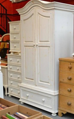 Lot 560 - Painted pine bedroom suite comprising wardrobe, chest, king-sized bed and cabinets