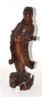 Lot 131 - A Chinese Wire Inlaid Hardwood Figure of Guanyin, Qing Dynasty, the standing figure in flowing...