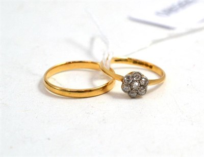 Lot 12 - An 18ct gold wedding band and an 18ct gold diamond cluster ring, total estimated diamond weight...