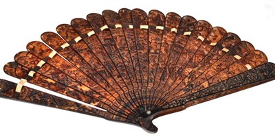 Lot 136 - A Cantonese Tortoiseshell Brisé Fan, 19th century, carved and pierced with figures in...