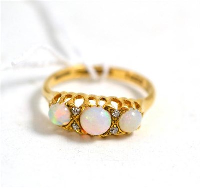 Lot 22 - An 18ct gold opal and diamond ring