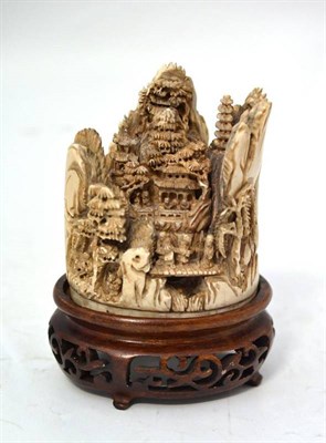 Lot 138 - A Chinese Ivory Mountain Group, circa 1900, carved with figures on a bridge with  pagodas and...