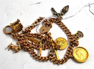 Lot 34 - A 9ct gold charm bracelet with attached half sovereign