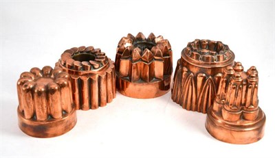 Lot 84 - Five 19th century copper jelly moulds including a castellated example and four geometric examples