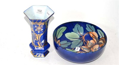 Lot 102 - Charlotte Rhead tube line decorated floral bowl and a blue and gold panelled vase, stamped...