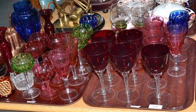 Lot 107 - Two trays of assorted coloured wine glasses, etc