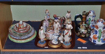Lot 112 - A floral decorated decanter, two Masons jugs, Continental figures, etc