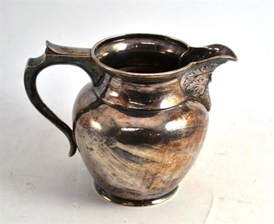 Lot 120 - Silver Elkington & Co. jug with mask spout