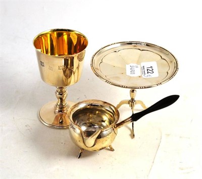 Lot 122 - A silver tripod table, goblet and ladle