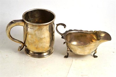 Lot 138 - A silver mug and a small sauce boat