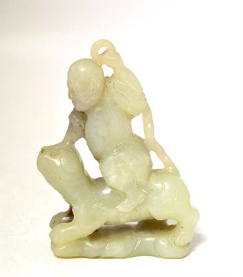 Lot 149 - A Jade Carving, depicting a diminutive figure riding on the back of a tiger, the jade of pale green