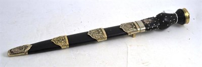 Lot 143 - A Scottish Dirk with black leather scabbard with thistle cast nickel mounts
