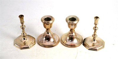 Lot 145 - A pair of taper sticks and a pair of silver loaded candlesticks