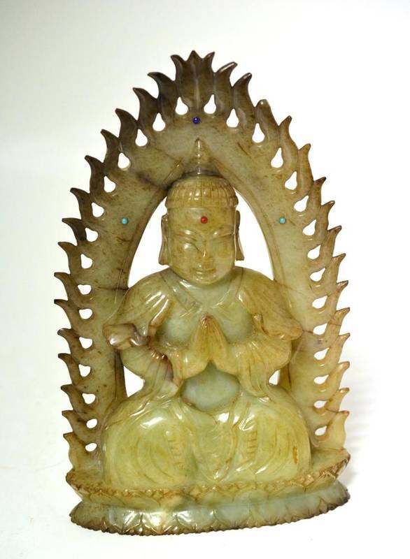 Lot 150 - A Green Jade Figure of a Seated Buddha, 18th/19th century, depicted seated in a meditating pose...