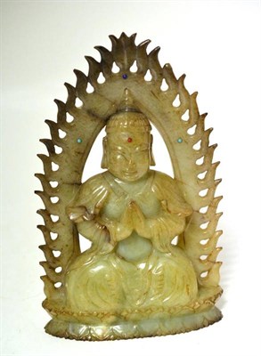 Lot 150 - A Green Jade Figure of a Seated Buddha, 18th/19th century, depicted seated in a meditating pose...